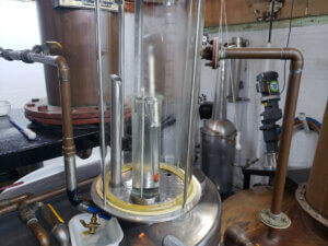 Distillate from the stripping run is monitored constantly with a hydrometer.