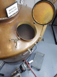 A look down into the interior of the beer still after the first stripping run of our corn whiskey.